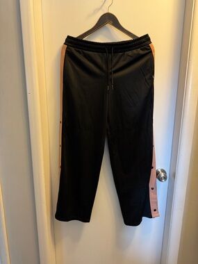 Vans women’s Black Track Pants with Tan Side Stripe